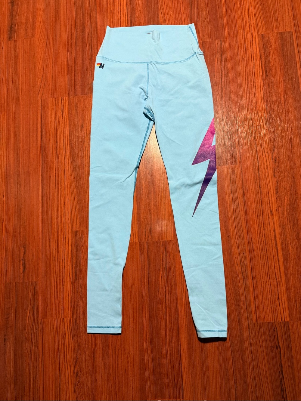 Aviator Nation Light Blue Jogger Leggings with Purple Lightning Graphic